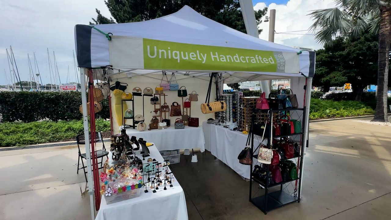 Aquia Holmes, the owner of Uniquely Handcrafted, has operated her tent at the Pier Marketplace since 2020. She said a kiosk could make day-to-day operations easier. (Spectrum News)