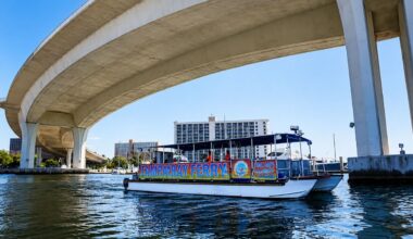 Tampa Bay Ferry vessel travels beneath a bridge in Tampa Bay.