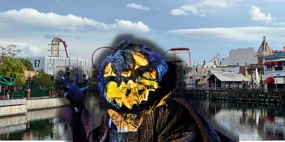 Guests enter Universal Studios Florida beneath Halloween Horror Nights signage ahead of HHN 35.