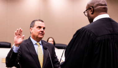 Orange County District 2 Commissioner Michael “Mike” Crabb (L) takes the oath of office from Ninth Judicial Circuit Judge Andrew Bain (R) on Tuesday, Aug. 25, at the Orange County Administration Center. Crabb was sworn in shortly before taking his seat for his first Board of County Commissioners meeting.