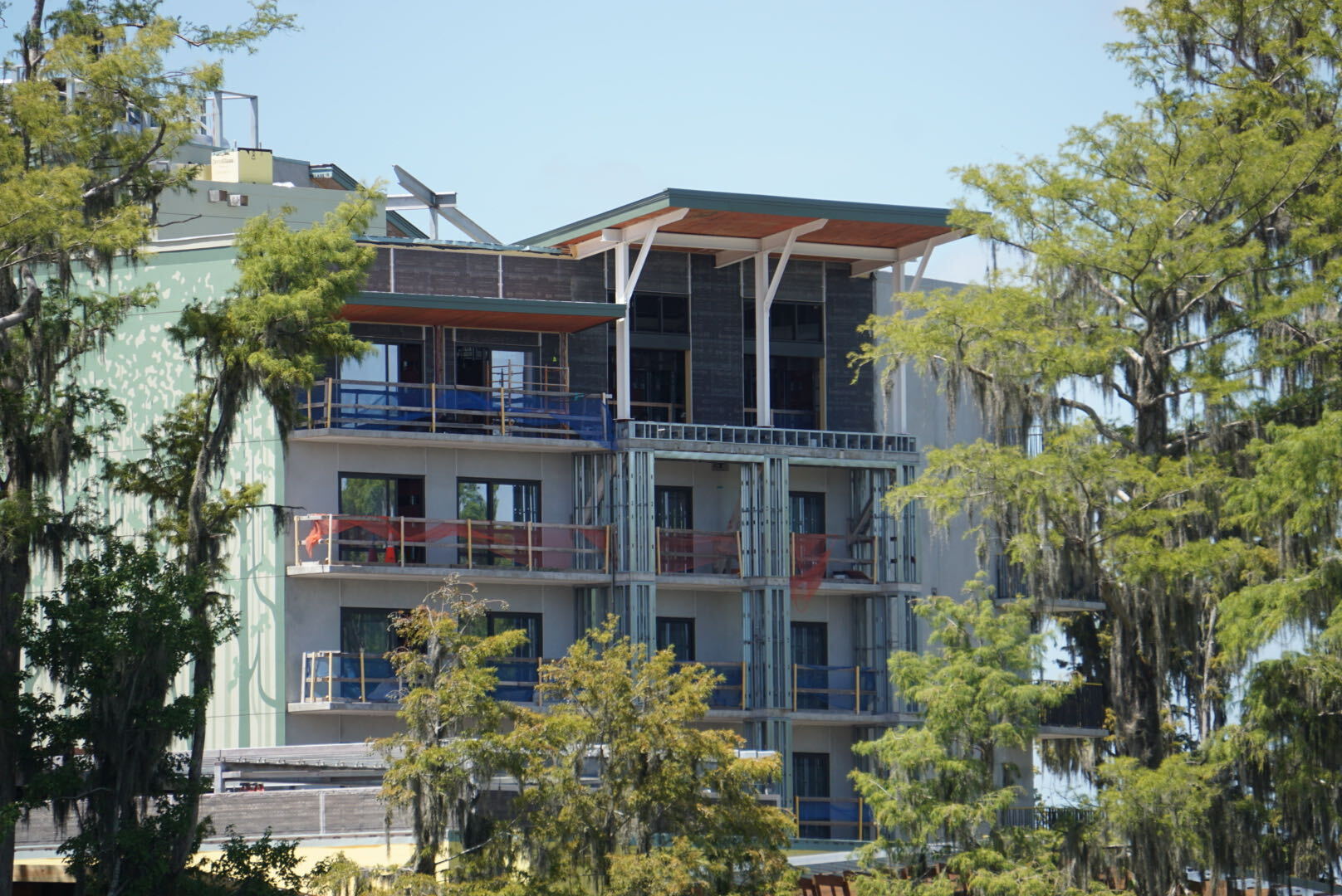 A new bridge, additional tree murals, and dark green tower finishes are among the latest additions to Disney Lakeshore Lodge.