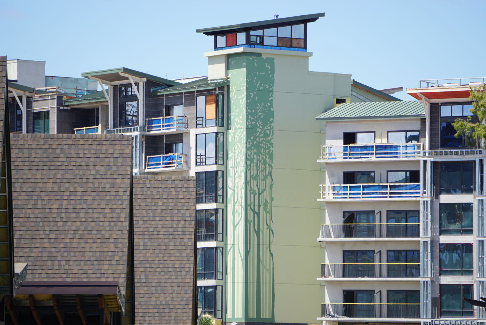 A new bridge, additional tree murals, and dark green tower finishes are among the latest additions to Disney Lakeshore Lodge.