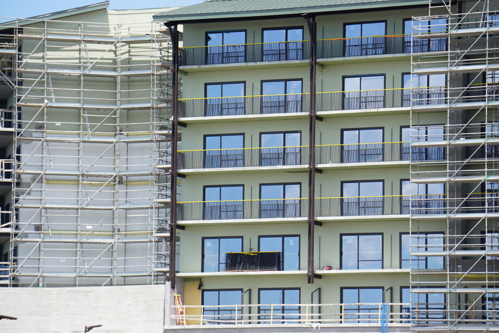 A new bridge, additional tree murals, and dark green tower finishes are among the latest additions to Disney Lakeshore Lodge.
