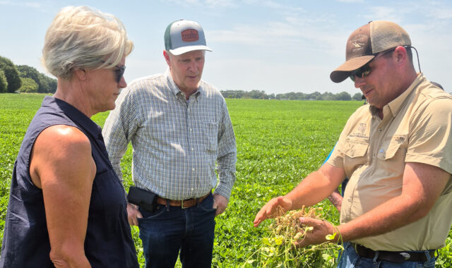 Agriculture Commissioner Wilton Simpson (center) reviewed the charitable peanut butter processing elements Tuesday. (Image via Feed Florida)