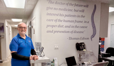 Dr. Adlai Green poses in the receptionist's office at Apopka Wellness Center.