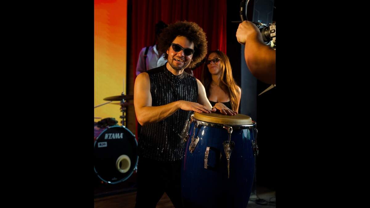 Degnis Bofill playing the conga in a photo from his recent music video for Caminate Miami Degnis Bofill playing the conga in a photo from his recent music video for Caminate Miami