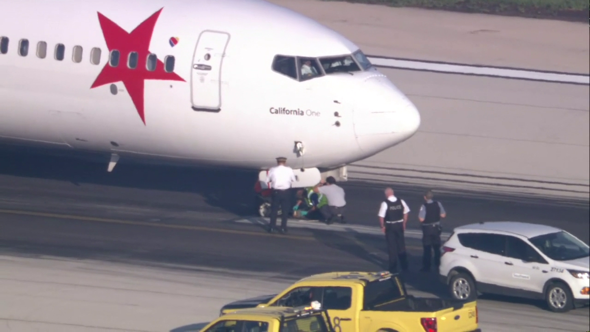 Southwest jet from RSW towed off runway after landing in Chicago with two flat tires