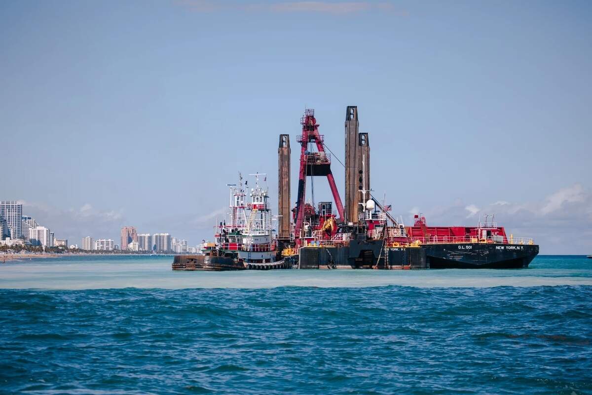 The dredging equipment in operation being used in the sand bypass project off the beach north of Port Everglades