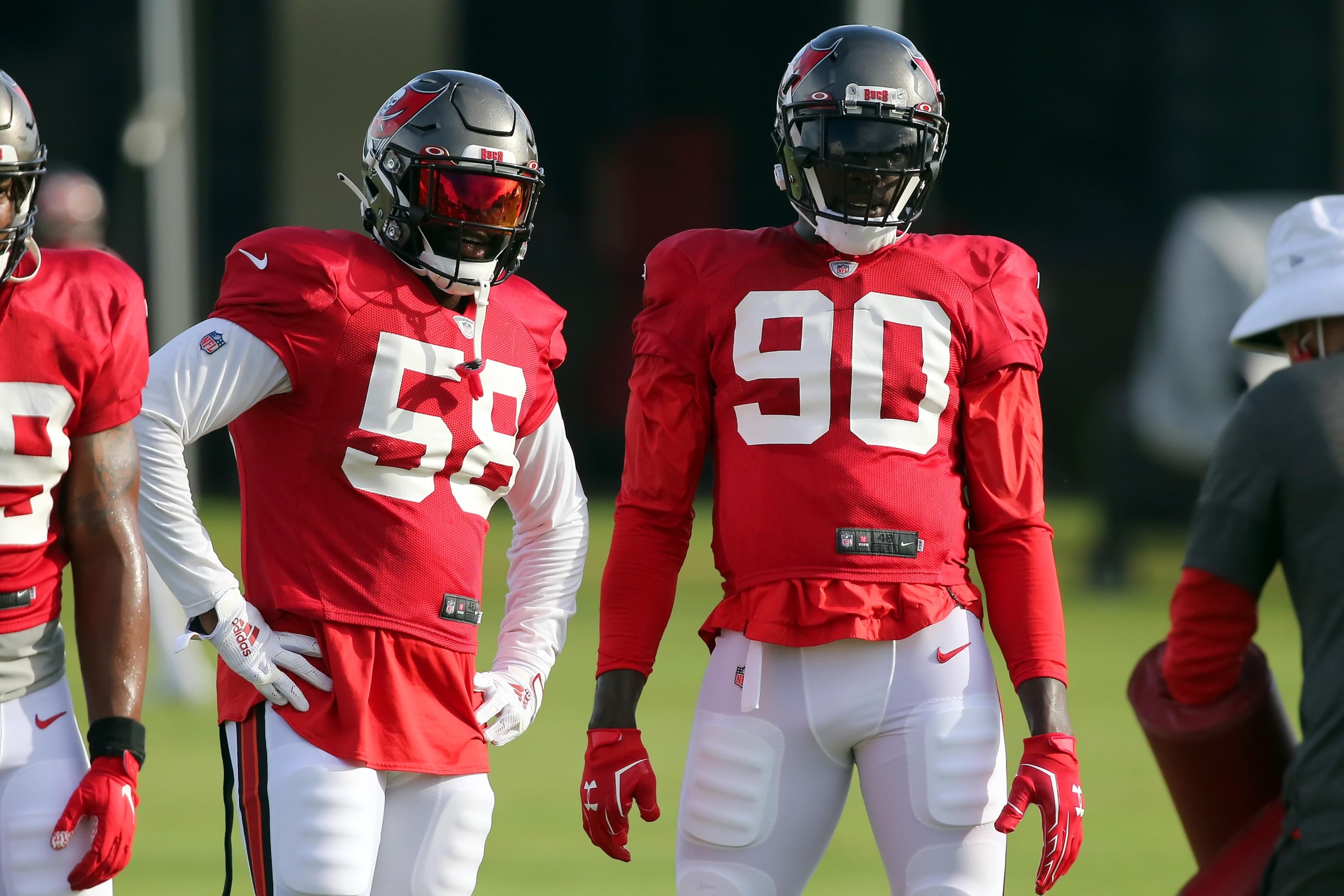 TAMPA, FL - AUG 18: Shaq Barrett (58) and Jason Pierre-Paul (90) of the Buccaneers watch a drill during the Tampa Bay Buccaneers Training Camp on August 18, 2020 at the AdventHealth Training Center in Tampa, Florida. (Photo by Cliff Welch/Icon Sportswire via Getty Images)