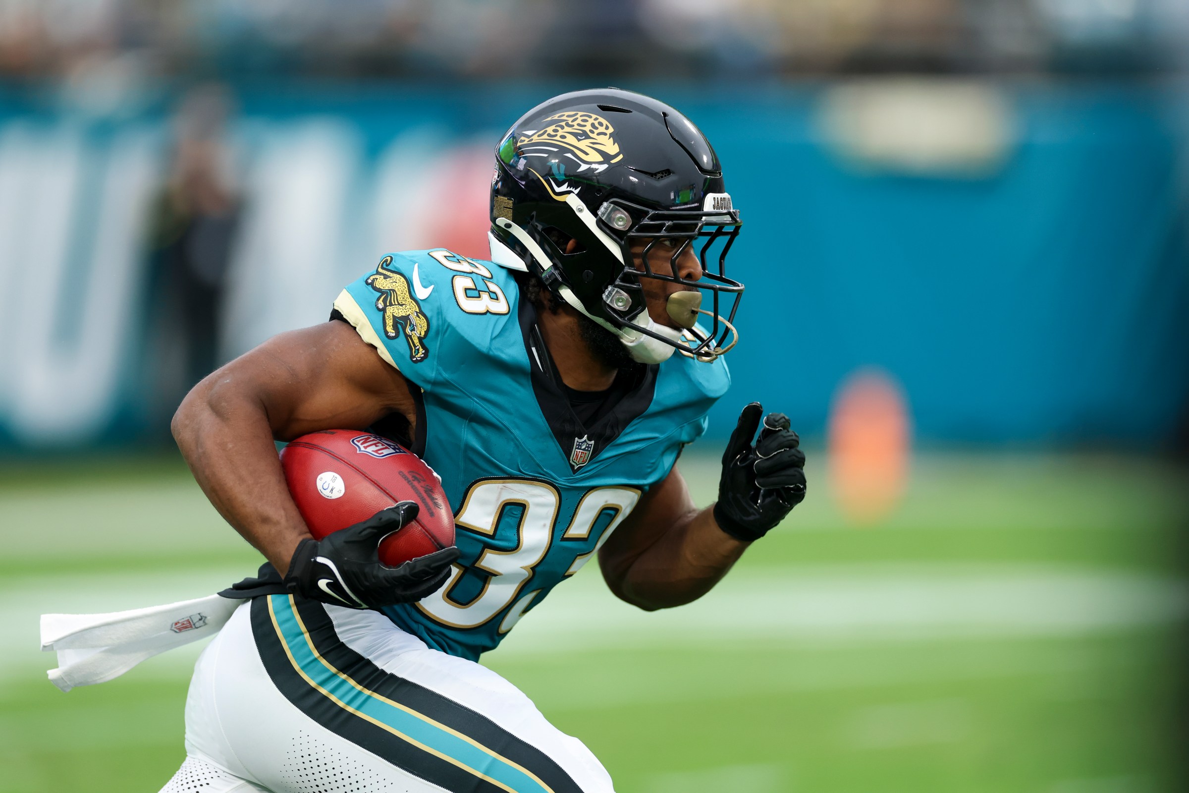 JACKSONVILLE, FLORIDA - DECEMBER 7: Bhayshul Tuten #33 of the Jacksonville Jaguars runs the ball during an NFL 2025 game against the Indianapolis Colts at Everbank Stadium on December 7, 2025 in Jacksonville, Florida. (Photo by Logan Bowles/Getty Images)