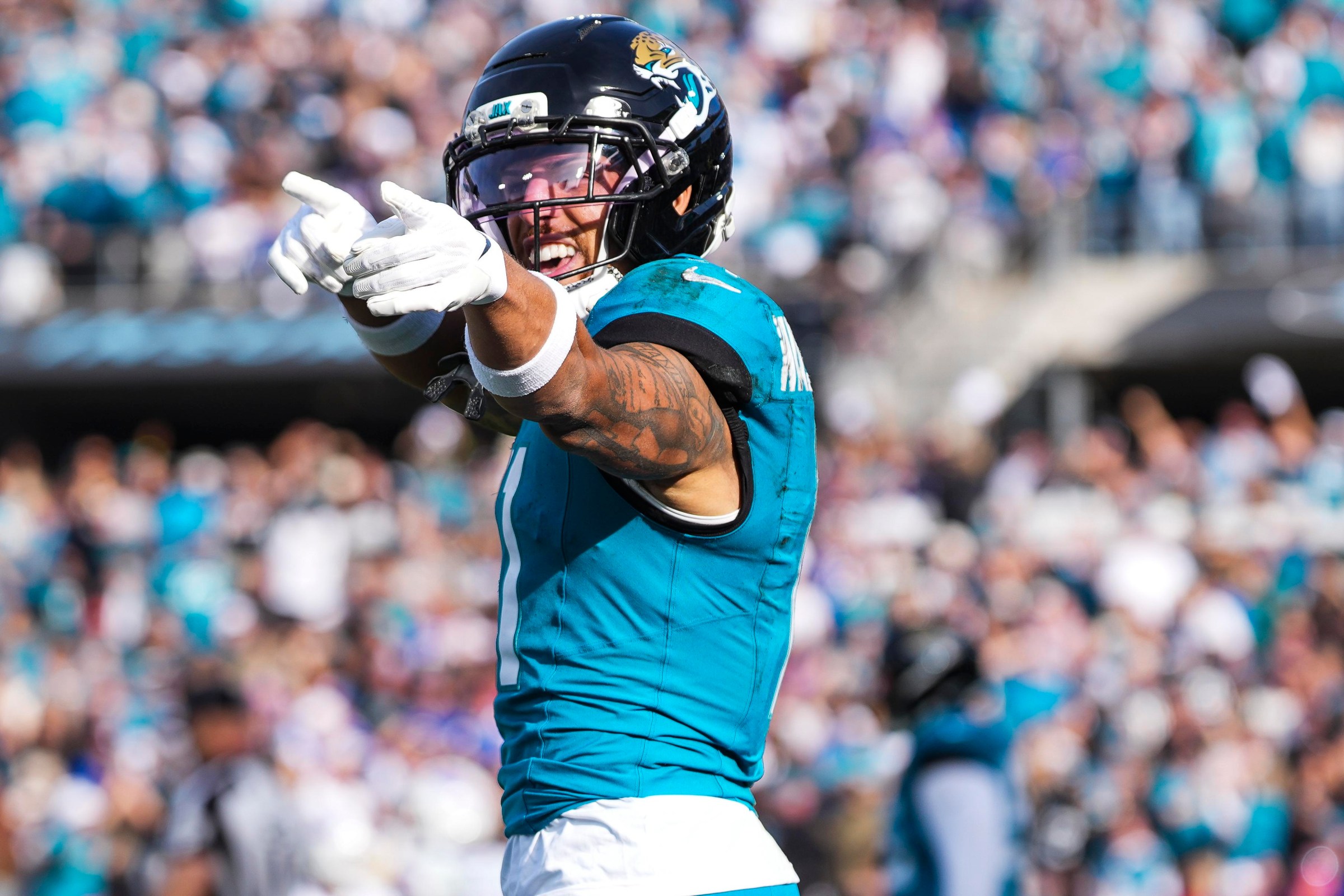 JACKSONVILLE, FLORIDA - JANUARY 11: Parker Washington #11 of the Jacksonville Jaguars celebrates during an NFL wild card playoff football game against the Buffalo Bills at EverBank Stadium on January 11, 2026 in Jacksonville, FL. (Photo by Perry Knotts/Getty Images)