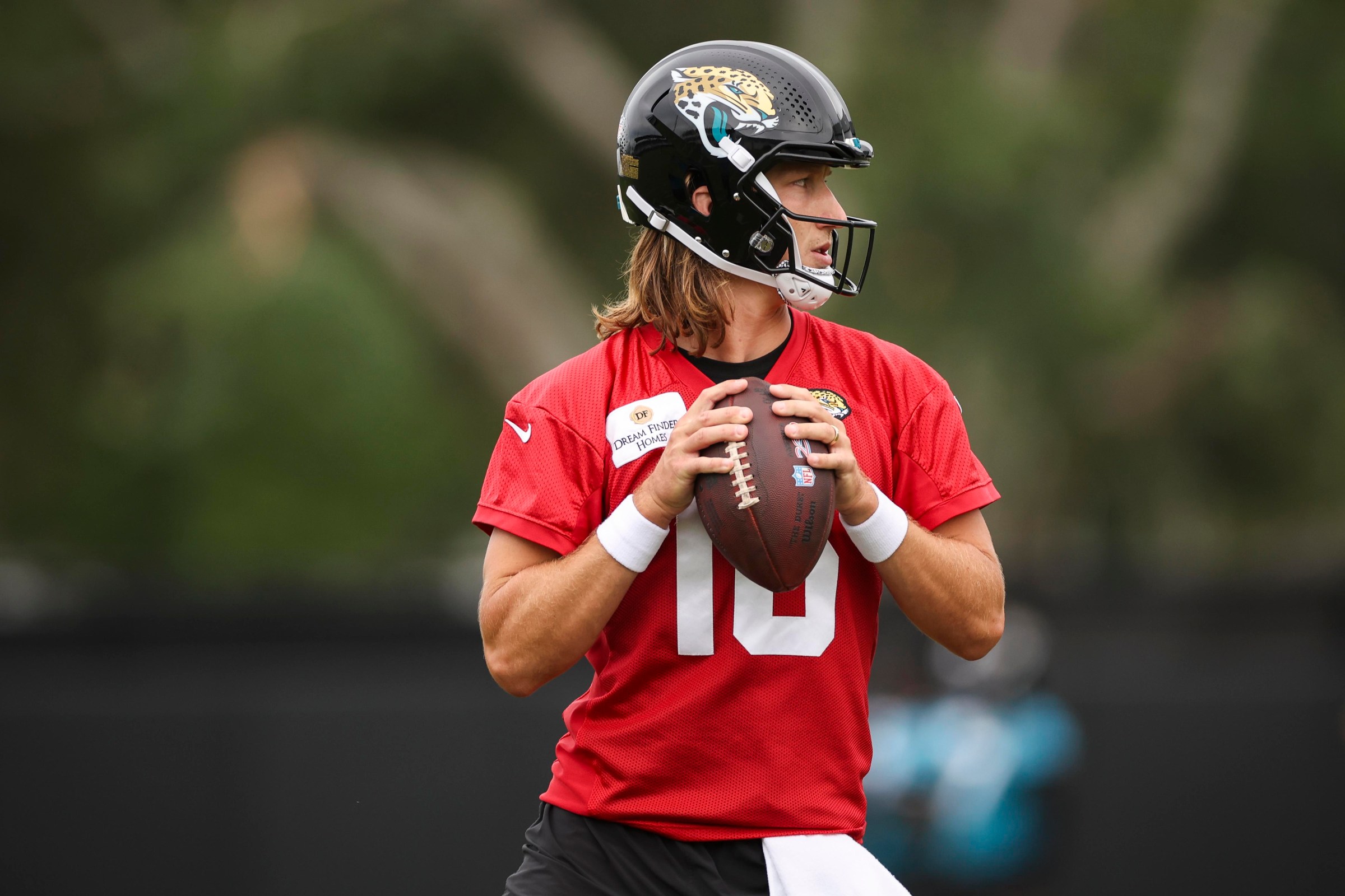 JACKSONVILLE, FLORIDA - JUNE 09: Trevor Lawrence #16 of the Jacksonville Jaguars looks to pass the ball during Mandatory Minicamp at Miller Electric Center on June 09, 2026 in Jacksonville, Florida. (Photo by James Gilbert/Getty Images)