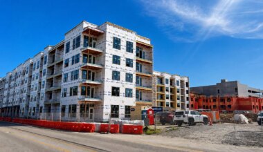 The Henry at Whitney Village, a 325-unit apartment complex, tops out in the Grand Central District