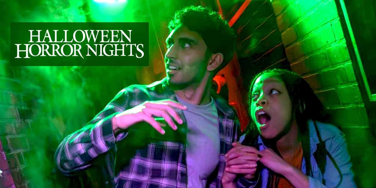 Guests enter Universal Studios Florida beneath Halloween Horror Nights signage at Universal Orlando Resort.