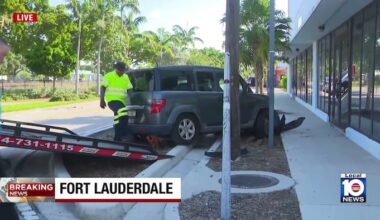 2-vehicle crash leaves car on its side, another against Fort Lauderdale building