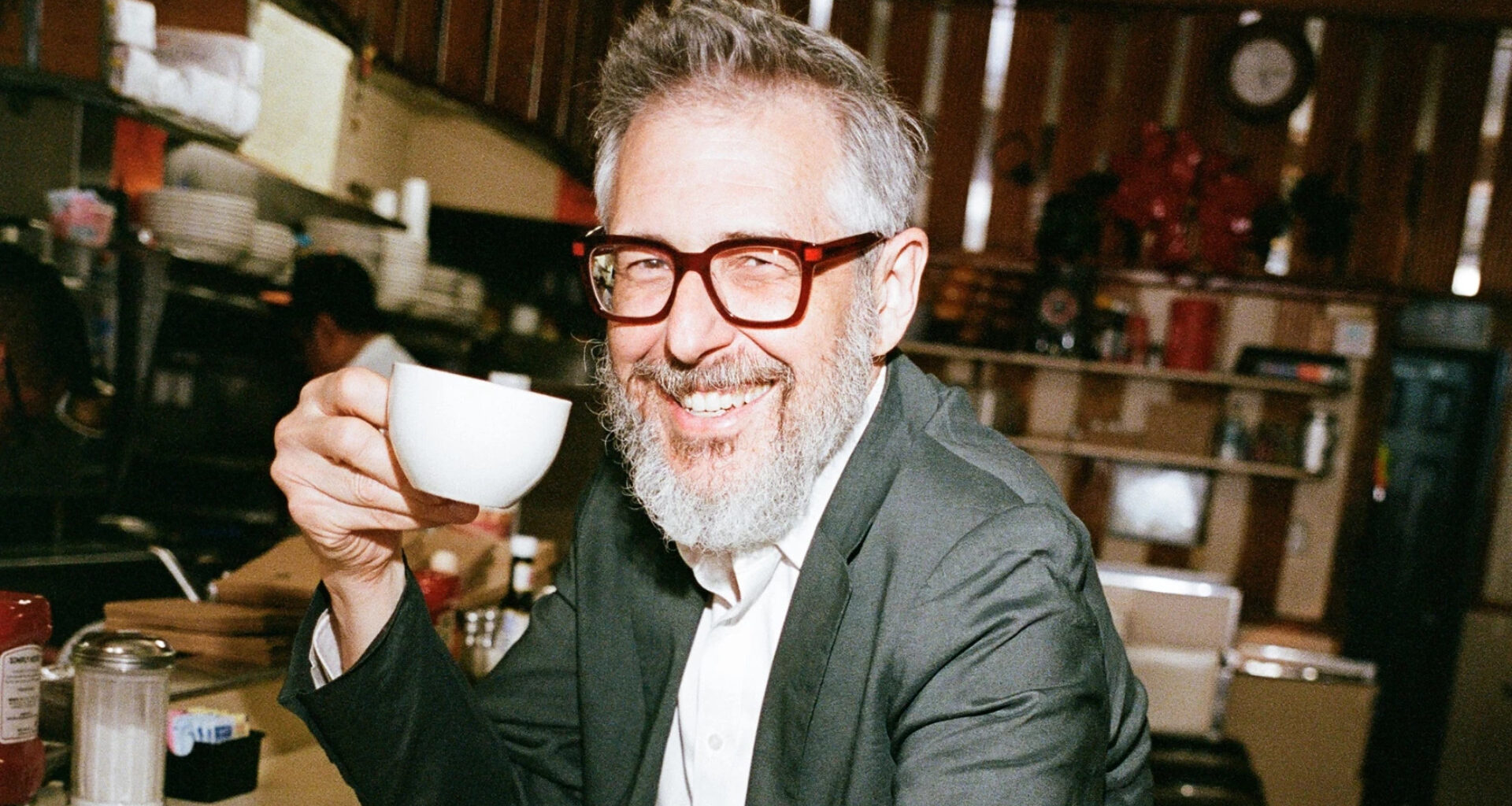 man holding coffee cup