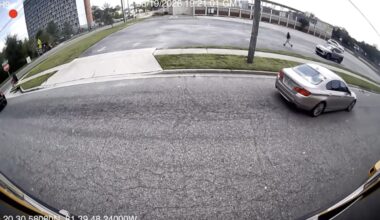 Stop-arm camera footage shows a car passing a stopped school bus on North Jefferson Street. Photo courtesy Duval County Public Schools