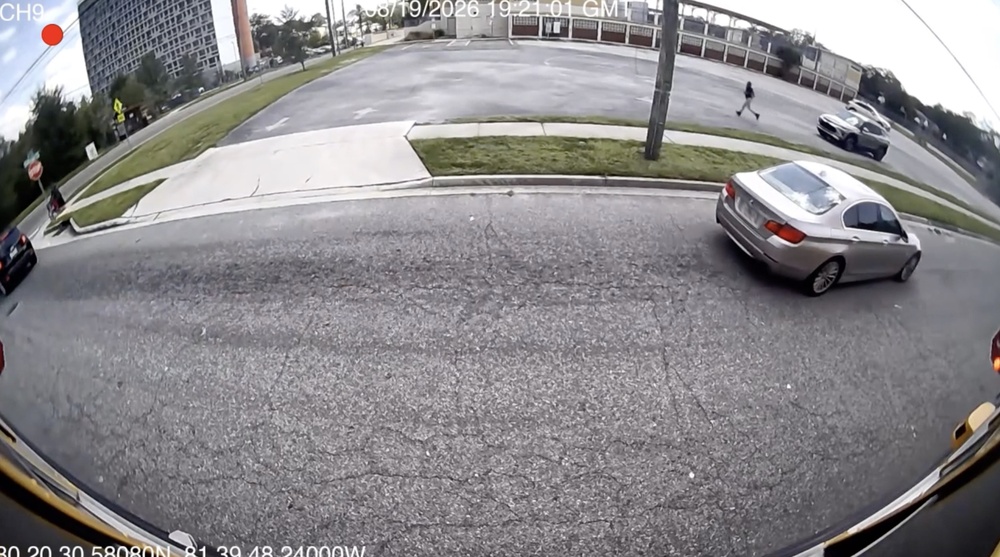 Stop-arm camera footage shows a car passing a stopped school bus on North Jefferson Street. Photo courtesy Duval County Public Schools