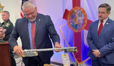 Sgt. Gene Tolbert with the St. Johns County Sheriff's Office demonstrates a makeshift gun confiscated during an investigation into two local teenagers. The gun, made of piping and wood, was part of a cache that included other makeshift firearms and explosive material.