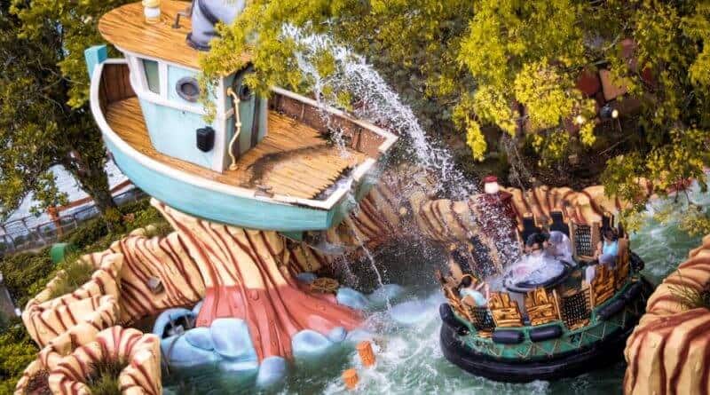Popeye & Bluto’s Bilge Rat Barges sends rafts splashing through water past a whimsical, cartoon-style boat beneath lush trees at Universal’s Islands of Adventure; note that the attraction occasionally closes for seasonal refurbishment.