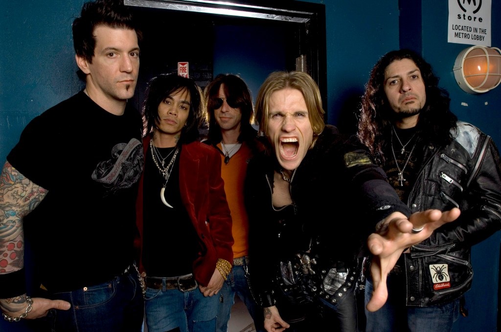 Portrait of the American rock band Buckcherry posing backstage.