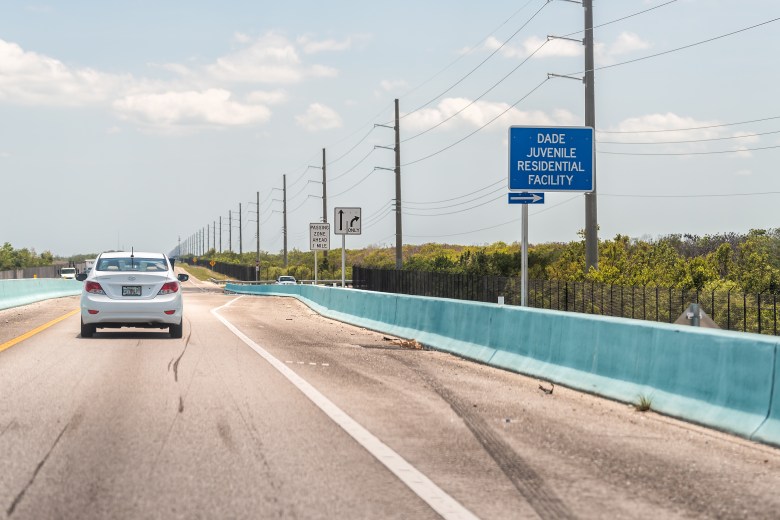 Roadside direction sign for Dade Juvenile Residential Facility along Overseas Highway Florida Keys