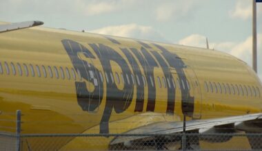 The right side of a parked yellow plane reveals the Spirit Airlines logo. (Spectrum News)