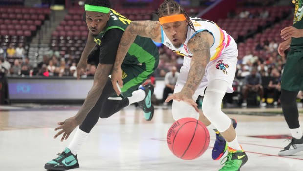 Miami 305's Michael Beasley (right) dives for a loose ball vs. Boston Ball Hogs' Quincy Miller during the second half of a BIG3 game on Friday, July 31, 2026. (Jim Rassol/Contributor).