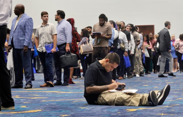 James Melnicoff fills out a job application during the Fort Lauderdale-Hollywood International Airport fifth annual job fair at the Broward County Convention Center on Friday, Aug. 28, 2026. (Mike Stocker/South Florida Sun Sentinel)