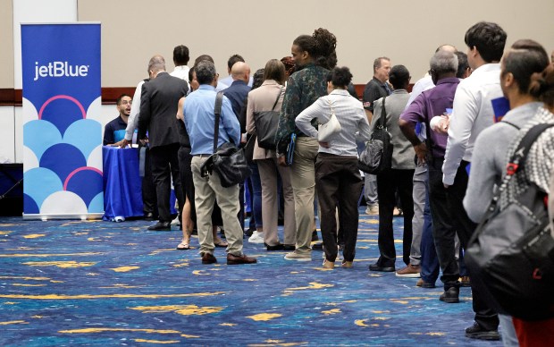applicants line up to inquire about jobs at JetBlue during the Fort Lauderdale-Hollywood International Airport fifth annual job fair at the Broward County Convention Center in Fort Lauderdale on Friday, Aug. 28, 2026. (Mike Stocker/South Florida Sun Sentinel)