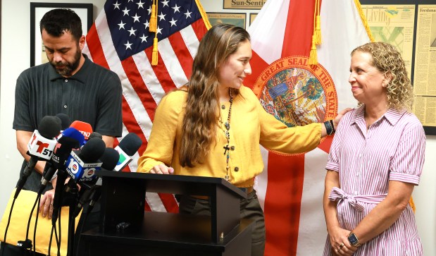 Family member Gabriel Dominguez, left, and Claudia Carolina Rodriguez Caglianone, of Davie, thank Congresswoman Debbie Wasserman Schultz about conditions at ICE facilities during a press conference in Sunrise on Tuesday, Aug. 4, 2026. Rodriguez Caglianone was detained for eight days at an ICE facility in Miramar. (Carline Jean/South Florida Sun Sentinel)