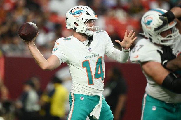 Miami Dolphins quarterback Quinn Ewers (14) aims a pass during the first half of an NFL preseason football game against the Washington Commanders, Friday, Aug. 14, 2026, in Landover, MD. (AP Photo/Nick Wass)