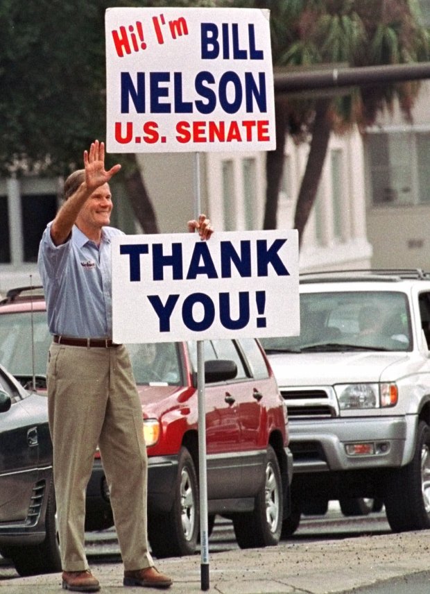 U.S. Senator-elect Bill Nelson waves to motorists passing by the Florida Capitol after his election in 2000. Nelson, who had represented Central Florida in Congress, went on to serve three terms in the Senate. (The Associated Press file) 