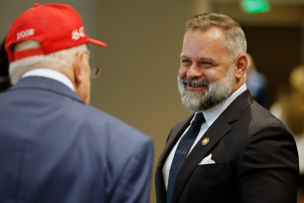 Volusia GOP Committeeman Vic Baker talks with U.S. Congressman Cory Mills before the Republican primary debate for Florida's 7th Congressional District, at the Brannon Center in New Smyrna Beach, Fla., on Wednesday, August 5, 2026. (Ricardo Ramirez Buxeda/ Orlando Sentinel)