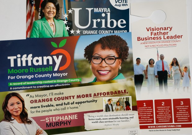 Campaign flyers for the Orange County mayoral candidates Chris Messina, Tiffany Moore Russell, Stephanie Murphy and Mayra Uribe. The four candidates seeking the region's most powerful office will face off in the Aug. 18 primary. (Rich Pope/Orlando Sentinel)