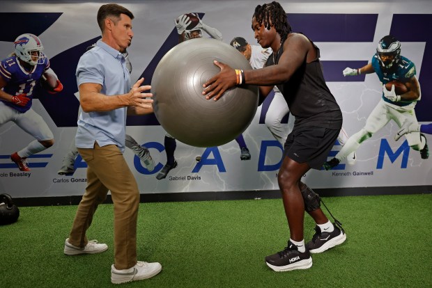 Former FSU linebacker Ethan Pritchard works out with physical therapist Alex Mendez at The Draft Academy, on Friday, August 28, 2026. Pritchard was shot in the head in an incident near Tallahassee last year. He is recovering and will walk on the field for the FSU opener on Saturday night. (Ricardo Ramirez Buxeda/ Orlando Sentinel)
