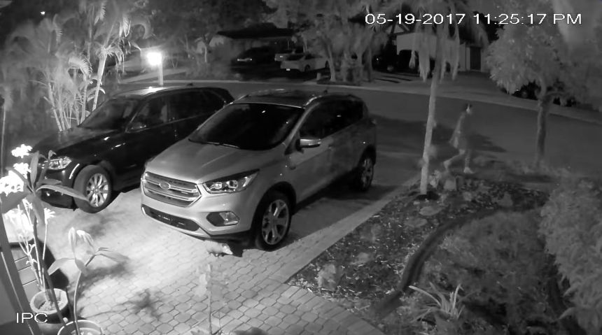 On video footage from a neighbor's home, Sophie Reeder can be seen walkinig down the sidewalk.