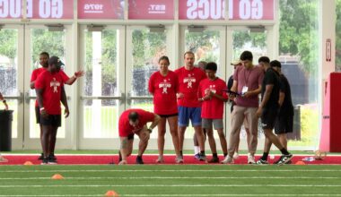 Active duty military members prepare for the 40-yard-dash at the USAA's Salute to Service NFL Boot Camp at the Tampa Bay Buccaneers' AdventHealth Training Center. (Spectrum News/Michael Epps)