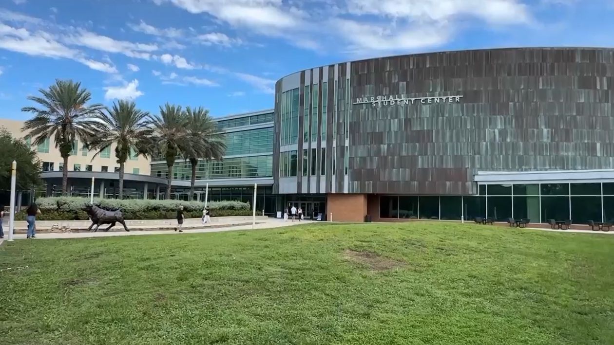 Students walk to the Marshall Student Center at the University of South Florida, where police say they are re-emphasizing public safety programs on campus, and working to create an Advisory Council that will help bring together several smaller campus groups that focus on student safety. (Spectrum News)