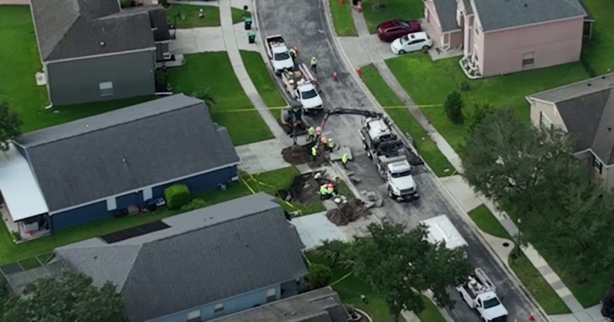 Large hole opens in Orange County neighborhood, forcing families from homes