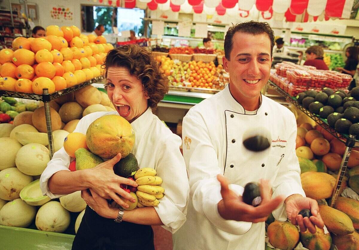 In 2000, chefs Michelle Bernstein of The Strand, left, and Frank Randazzo of Gaucho Room competed in a "ready, set, plate" contest at Epicure Market in Miami Beach Saturday. Using Epicure products, the two prepared a three-course meal in 15 minutes. About 150 people watched and voted on the winner. The results: a tie.