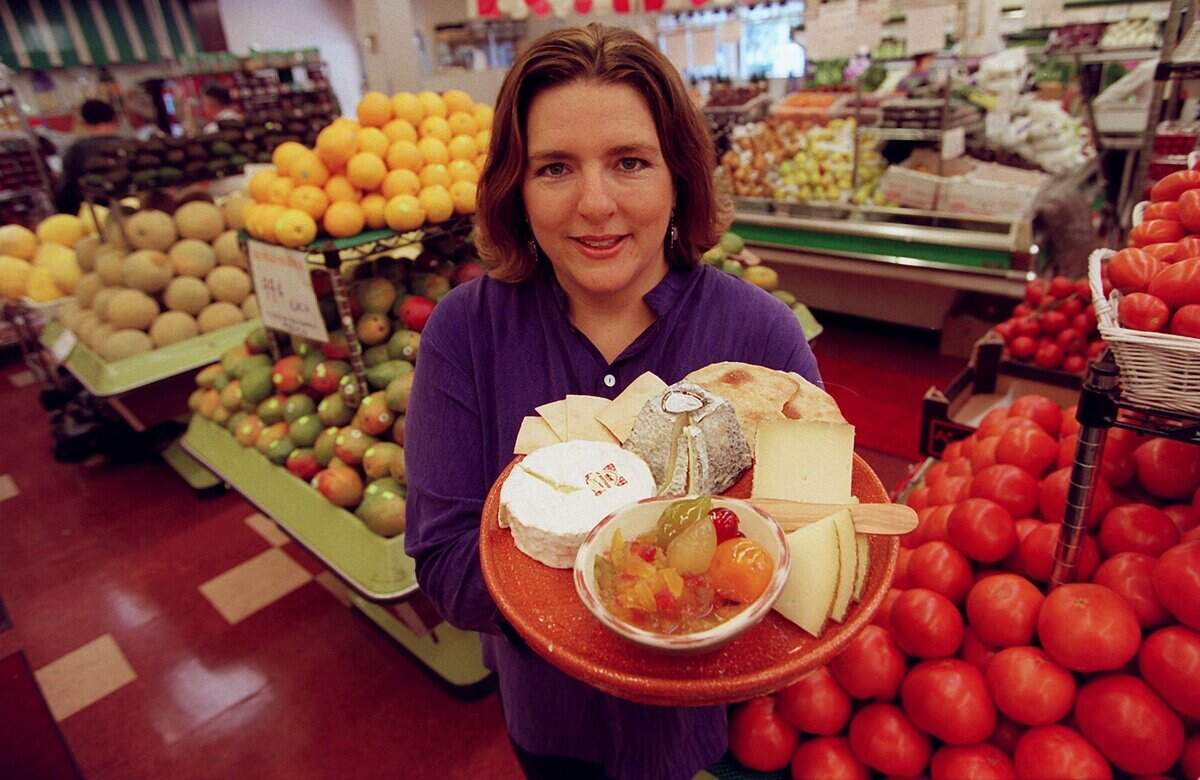 In 2001, Sarah Freedman-Izquierdo of Epicure Market shows some of the cheese at the Miami Beach store.