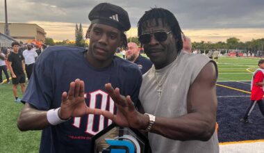 Columbus athlete and Miami commit A'mir Sears with former University of Miami star and Pro Football Hall of Famer Michael Irvin at St. Thomas Aquinas on Aug. 29, 2026.