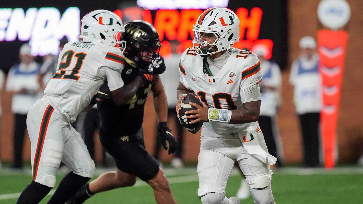 Sep 18, 2026; Winston-Salem, North Carolina, USA;  Miami (FL) Hurricanes quarterback Darian Mensah (10) rolls out to pass against the Wake Forest Demon Deacons during the second half at Allegacy Federal Credit Union Stadium.  Mandatory Credit: Jim Dedmon-Imagn Images