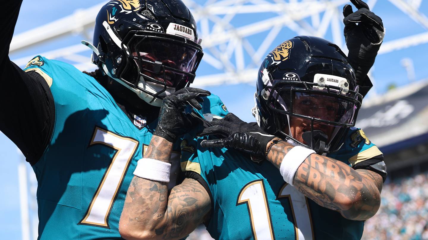 Sep 27, 2026; Jacksonville, Florida, USA;  Jacksonville Jaguars wide receiver Parker Washington (11) and offensive lineman Cole Van Lanen (70) celebrate a touchdown that was called back during the third quarter against the New England Patriots at EverBank Stadium.