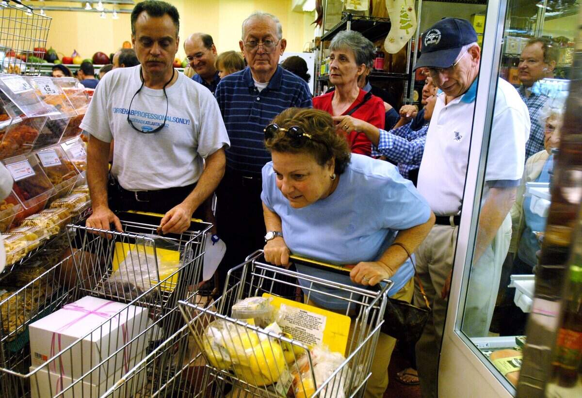 In 2004, Norma Sobel, center, goes through a traffic jam near the Epicure bakery section of the store.
