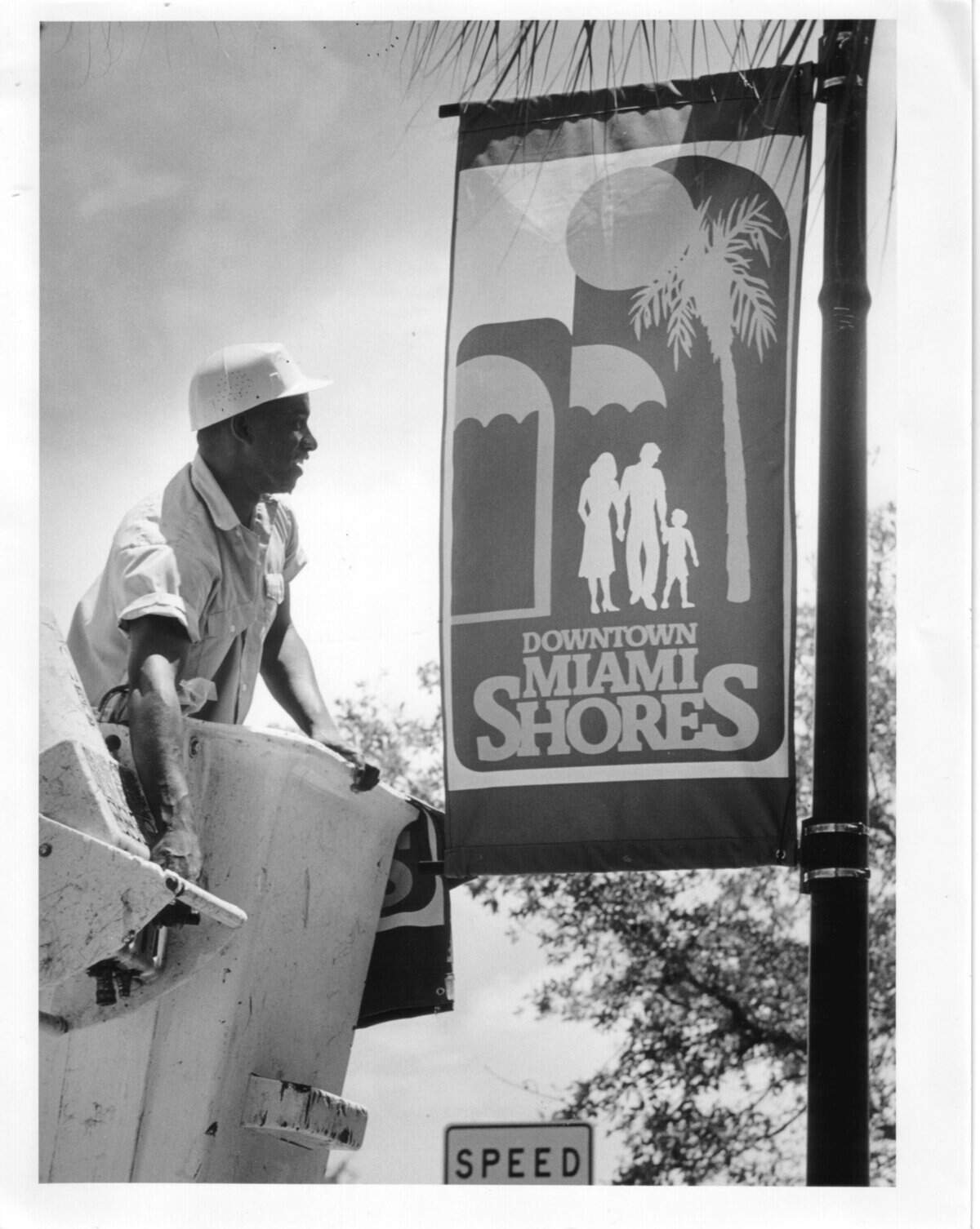 In this 1989 photo, equipment operator James Bradley puts up new downtown signs in Miami Shores. The downtown area of the village was getting a facelift with new busineses, landscaping and more pedestrian-friendly sidewalks.