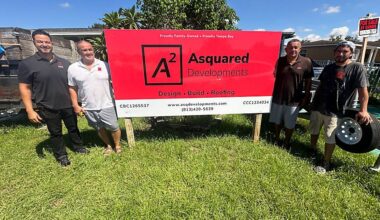Allan Nunez (left) with his father, uncle and an employee of Asquared Developments, at a site where a home is in its final stages of construction. (Spectrum News)