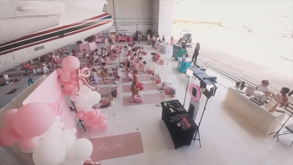 Buckle up and reach for the skies for a pink Pilates class next to private jets - WSVN 7News | Miami News, Weather, Sports