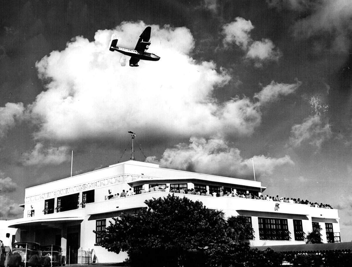 Pan American's Dinner Key terminal. People watched a plane's arrival from the observation deck.